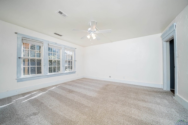 carpeted empty room featuring ceiling fan