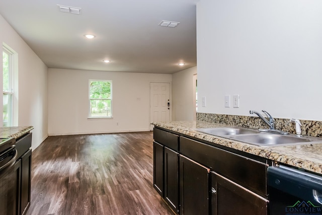 1205 Booker St, Longview, TX 75602 - kitchen featuring dishwasher, dark wood-style floors, stove, and recessed lighting