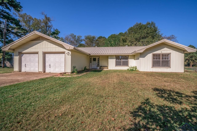 ranch-style home with a garage and a front lawn