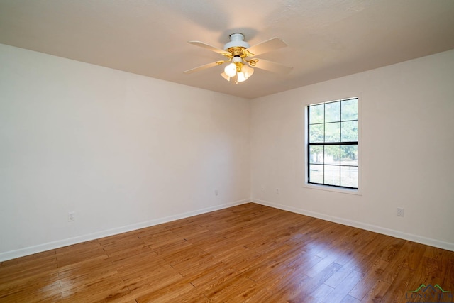 spare room featuring ceiling fan and light wood-type flooring