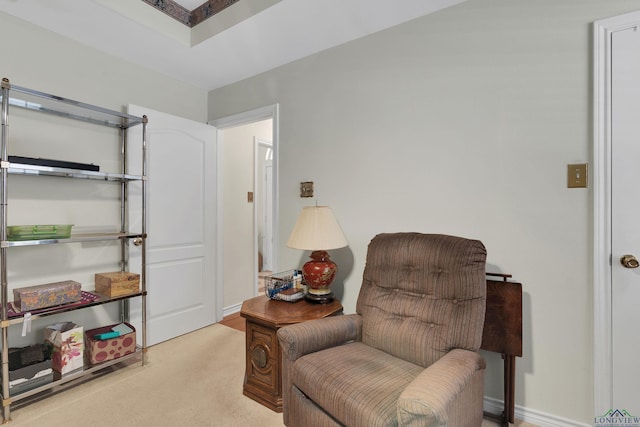 living area with light carpet