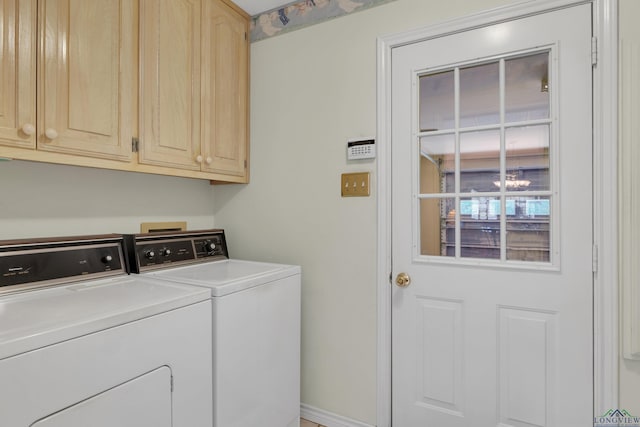 laundry area featuring cabinets and independent washer and dryer