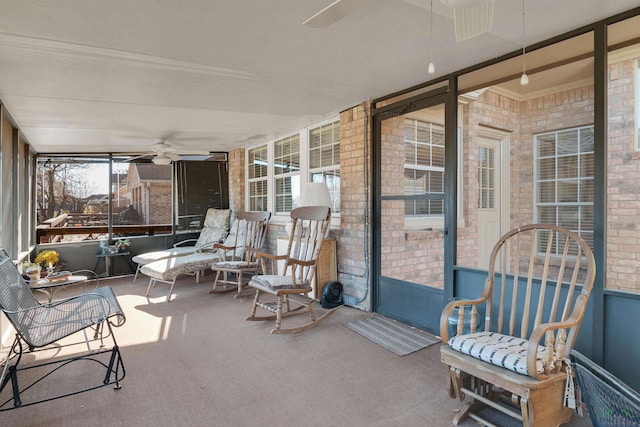 sunroom / solarium with ceiling fan