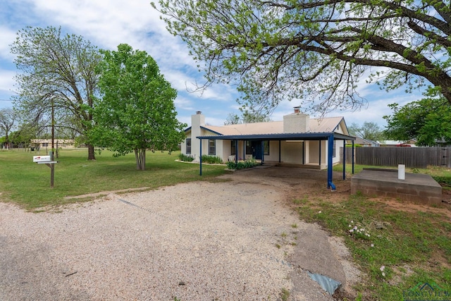 809 Turner Ln, Tuscola, TX 79562 - ranch-style home featuring dirt driveway, a chimney, metal roof, and a carport