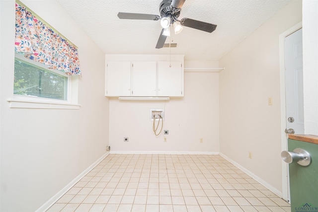 4525 Surratt Rd, Longview, TX 75604 - washroom with electric dryer hookup, washer hookup, cabinet space, ceiling fan, and a textured ceiling