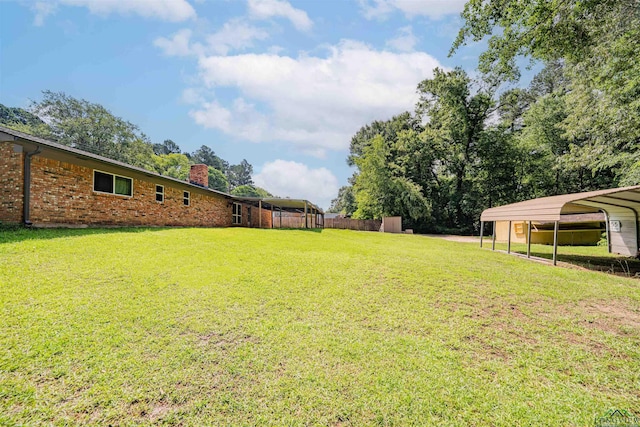 4525 Surratt Rd, Longview, TX 75604 - view of grassy yard featuring a carport
