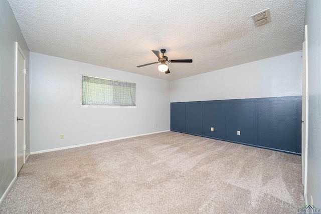 4525 Surratt Rd, Longview, TX 75604 - carpeted spare room with a ceiling fan, a textured ceiling, and baseboards