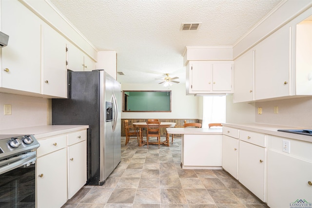 4525 Surratt Rd, Longview, TX 75604 - kitchen with appliances with stainless steel finishes, ceiling fan, light countertops, white cabinets, and a textured ceiling