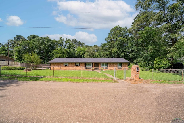 4525 Surratt Rd, Longview, TX 75604 - ranch-style house with a gate and view of wooded area