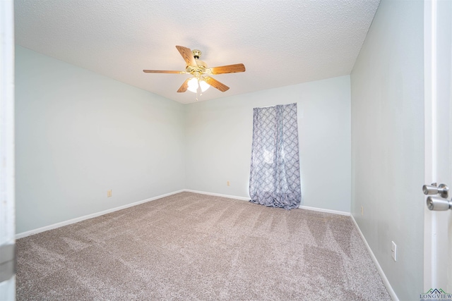 4525 Surratt Rd, Longview, TX 75604 - spare room featuring carpet, ceiling fan, baseboards, and a textured ceiling