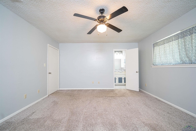 4525 Surratt Rd, Longview, TX 75604 - carpeted empty room with a ceiling fan, a textured ceiling, and baseboards