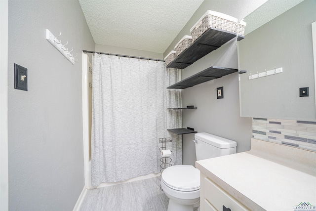 4525 Surratt Rd, Longview, TX 75604 - bathroom featuring toilet, tasteful backsplash, vanity, a textured ceiling, and curtained shower
