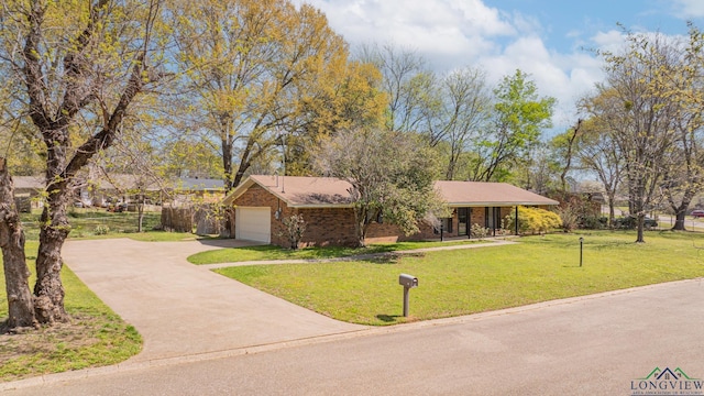 105 Sherwood Dr, Longview, TX 75605 - view of front facade with fence, a garage, a front yard, brick siding, and driveway