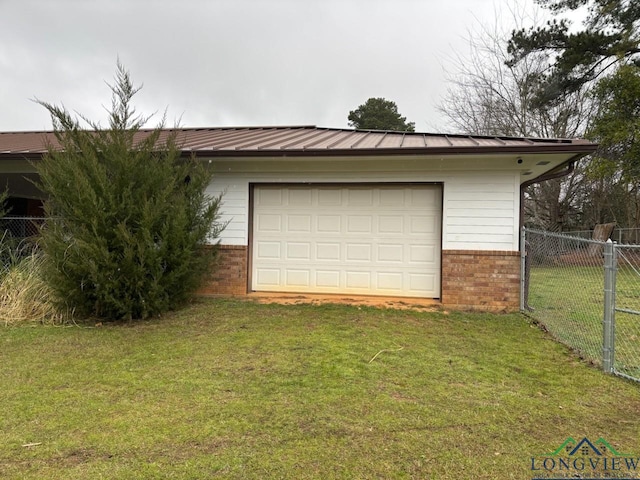 garage with driveway and fence