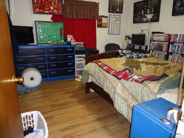 bedroom featuring wood finished floors