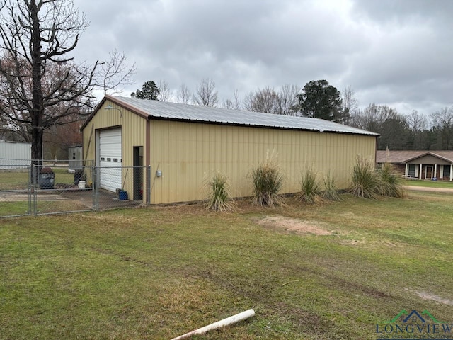 view of outbuilding featuring an outbuilding and fence