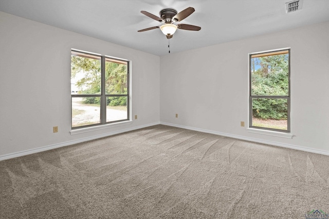 unfurnished room featuring carpet floors and ceiling fan