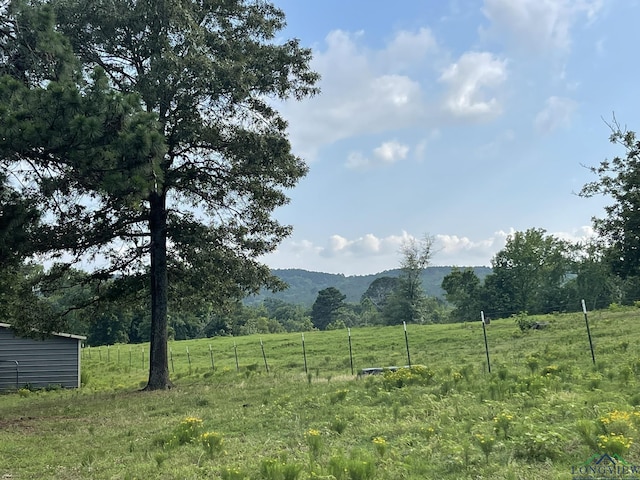 view of mountain feature featuring a rural view