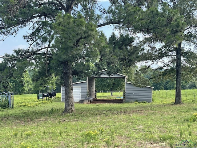 view of yard featuring a gazebo and a storage unit