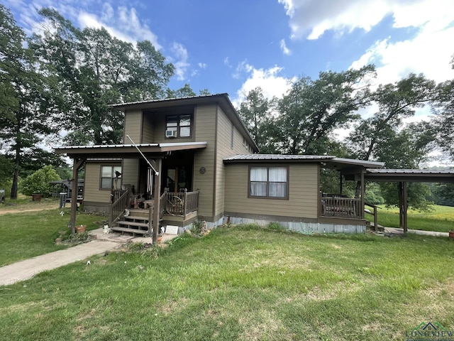 view of front of property with covered porch and a front yard