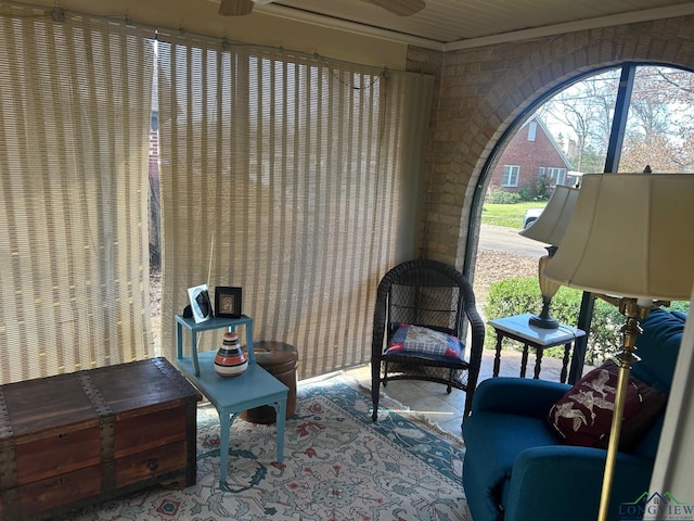 living area with brick wall