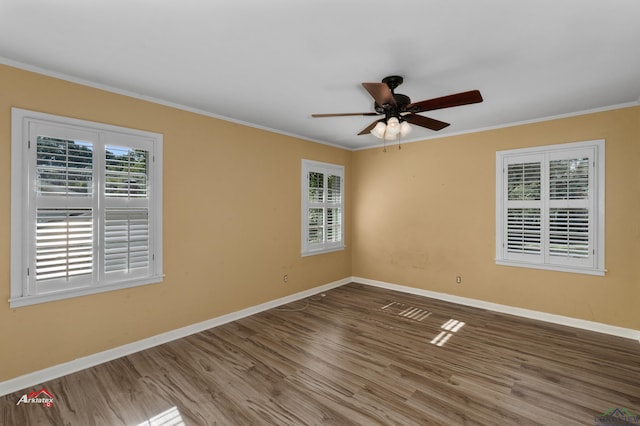 unfurnished room with hardwood / wood-style flooring, ceiling fan, and crown molding