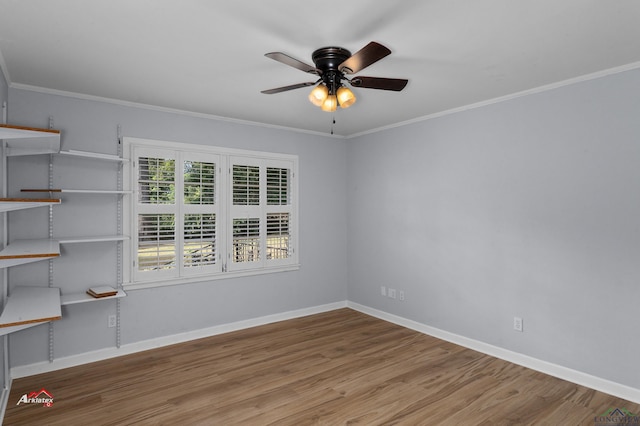 empty room featuring ceiling fan, light hardwood / wood-style flooring, and ornamental molding