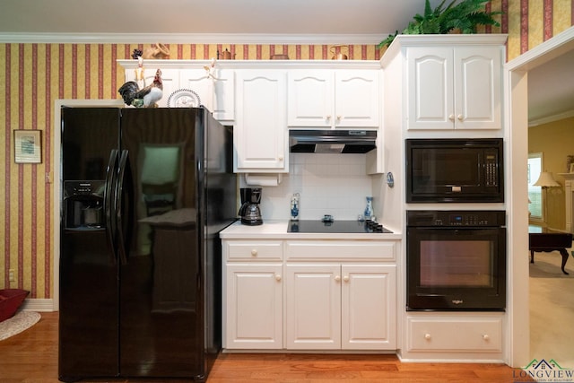 7 Casey Ct, Longview, TX 75604 - kitchen featuring black appliances, wallpapered walls, white cabinets, light wood-style flooring, and crown molding