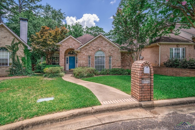7 Casey Ct, Longview, TX 75604 - view of front of house featuring brick siding and a front yard