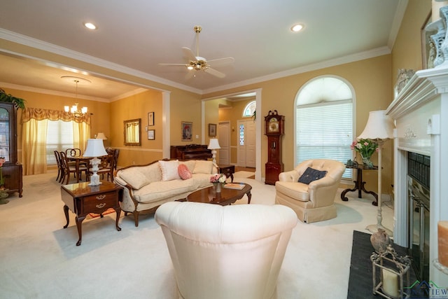 7 Casey Ct, Longview, TX 75604 - living area featuring light colored carpet, a glass covered fireplace, ornamental molding, a chandelier, and a ceiling fan