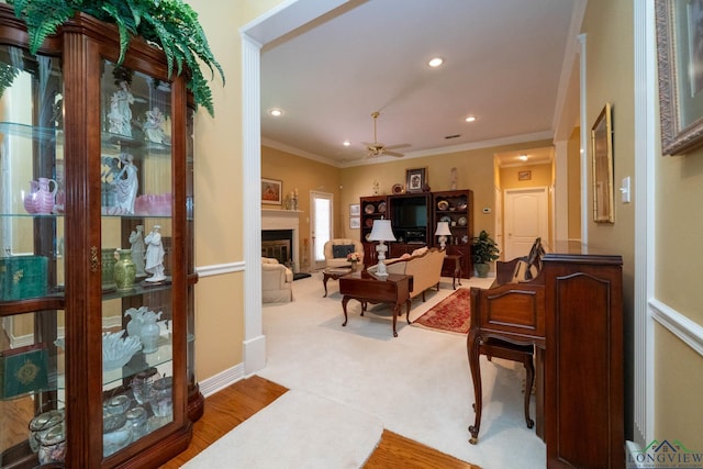 7 Casey Ct, Longview, TX 75604 - living area with ceiling fan, ornamental molding, recessed lighting, a fireplace, and wood finished floors