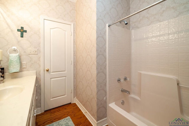 7 Casey Ct, Longview, TX 75604 - full bathroom with wood finished floors, wallpapered walls, shower / bathtub combination, and vanity
