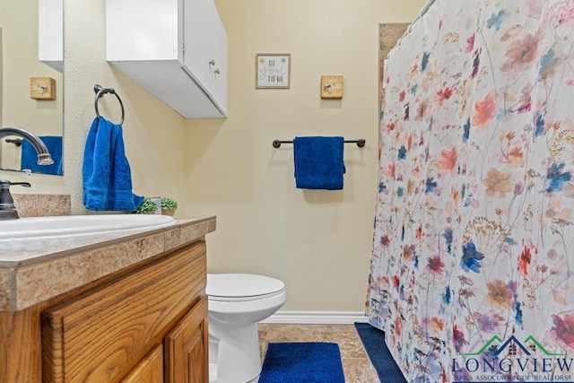 full bathroom with baseboards, toilet, a shower with curtain, tile patterned floors, and vanity