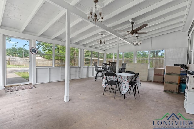 sunroom / solarium with lofted ceiling with beams and ceiling fan with notable chandelier