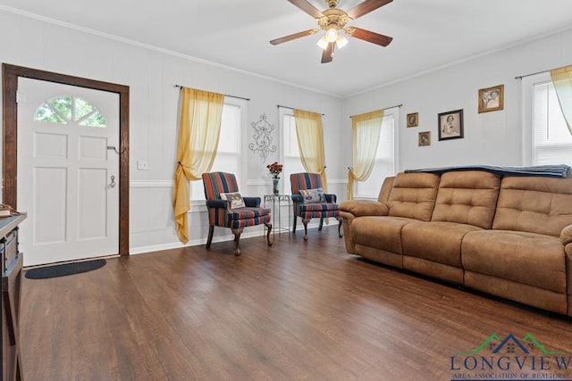 living area featuring ceiling fan, ornamental molding, and wood finished floors