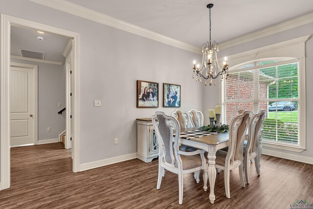 475 Highland Pl, Hallsville, TX 75650 - dining room featuring wood finished floors, visible vents, baseboards, and a notable chandelier