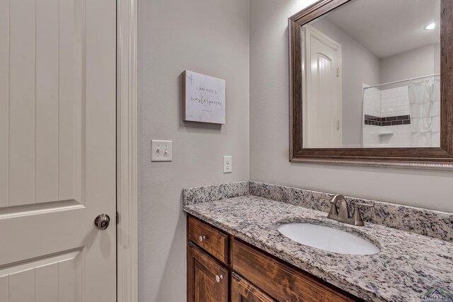 475 Highland Pl, Hallsville, TX 75650 - bathroom with vanity and a shower