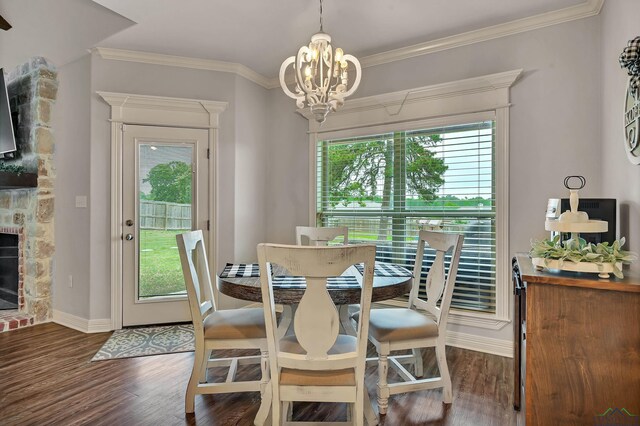 475 Highland Pl, Hallsville, TX 75650 - dining room featuring an inviting chandelier, baseboards, plenty of natural light, and wood finished floors
