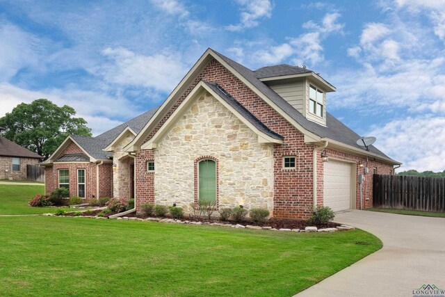 475 Highland Pl, Hallsville, TX 75650 - view of front of property with fence, brick siding, driveway, a garage, and a front yard