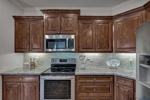 475 Highland Pl, Hallsville, TX 75650 - kitchen with crown molding, decorative backsplash, stainless steel appliances, and light stone countertops