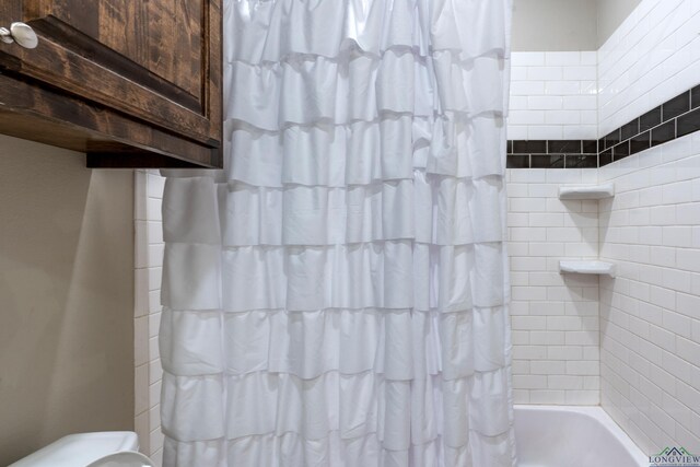 475 Highland Pl, Hallsville, TX 75650 - full bathroom featuring shower / bath combo
