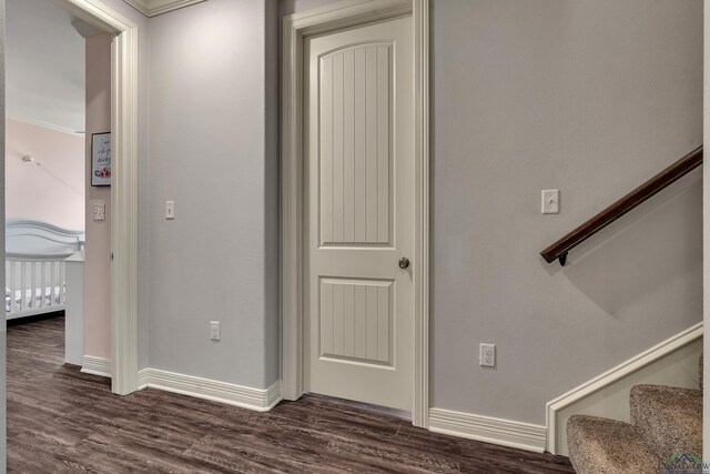 475 Highland Pl, Hallsville, TX 75650 - hall featuring baseboards, dark wood-style flooring, and stairway