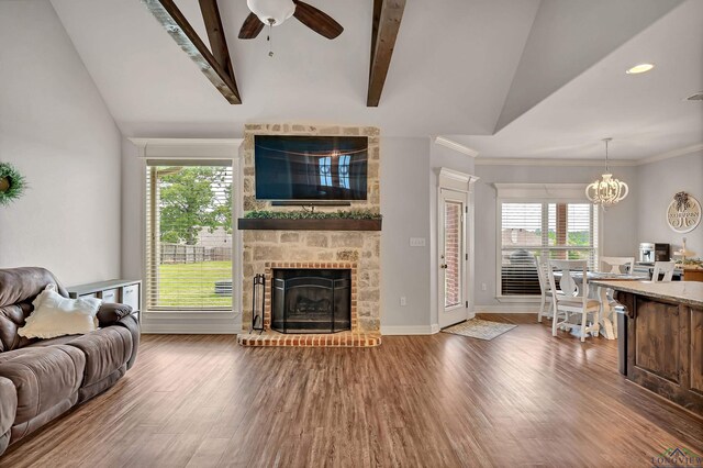 475 Highland Pl, Hallsville, TX 75650 - living area featuring vaulted ceiling, a wealth of natural light, and wood finished floors