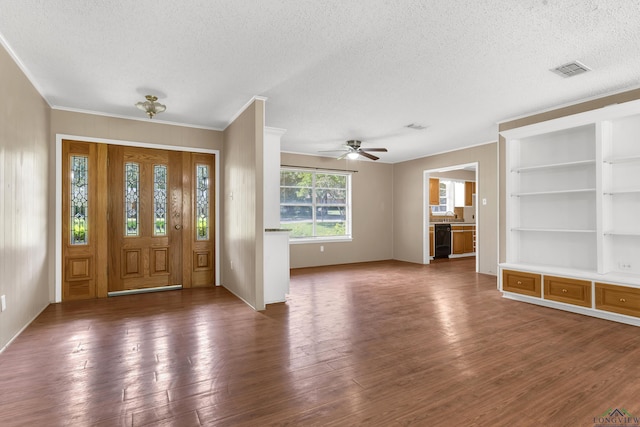 105 Bison Trl, Longview, TX 75601 - foyer entrance with a textured ceiling, wood finished floors, ceiling fan, and ornamental molding