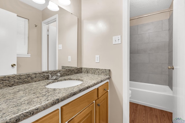 105 Bison Trl, Longview, TX 75601 - full bathroom with wood finished floors, vanity, toilet, and bathtub / shower combination