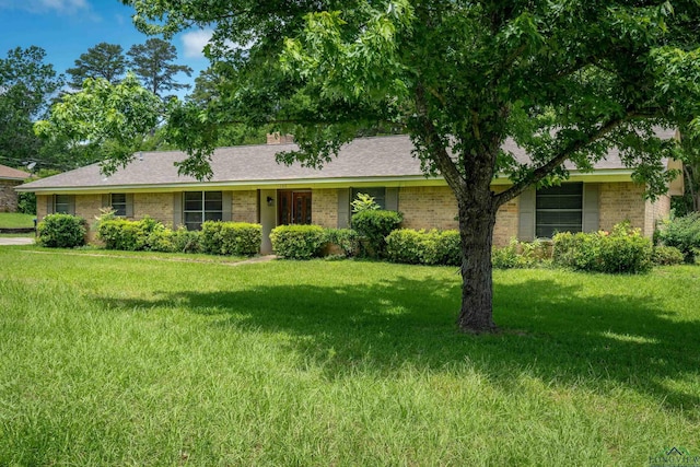 105 Bison Trl, Longview, TX 75601 - ranch-style home featuring brick siding, a front lawn, and a shingled roof