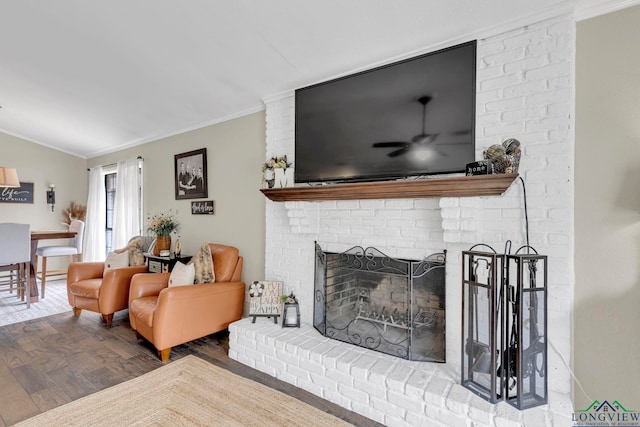 602 Pierce St, Lindale, TX 75771 - living area featuring wood finished floors, ornamental molding, a fireplace, and vaulted ceiling