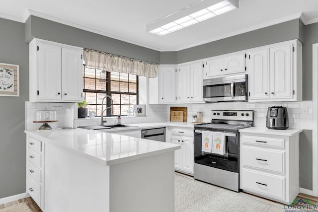 602 Pierce St, Lindale, TX 75771 - kitchen featuring appliances with stainless steel finishes, a peninsula, white cabinetry, ornamental molding, and tasteful backsplash