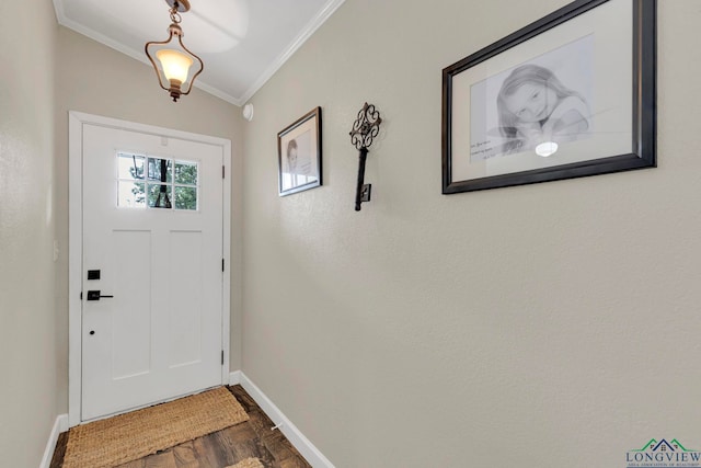 602 Pierce St, Lindale, TX 75771 - entryway with ornamental molding, baseboards, and dark wood-style flooring
