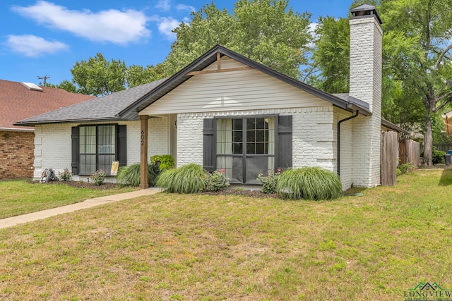 602 Pierce St, Lindale, TX 75771 - ranch-style house with brick siding, a chimney, and roof with shingles